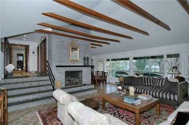 Great Room - Brick wood-burning fireplace and wall