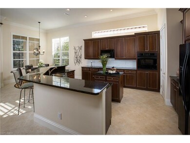 Open kitchen with center island and breakfast bar 