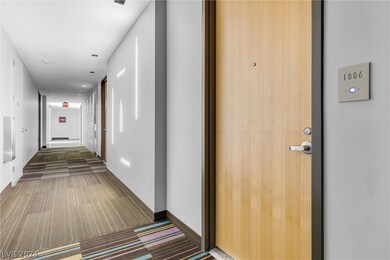 Hallway and Door to Unit