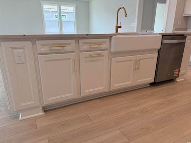 Kitchen featuring light countertops, stainless ste