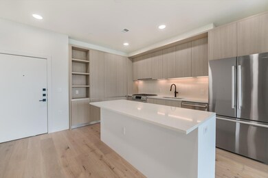 Kitchen with a center island, open shelves, a sin