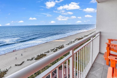 Balcony featuring a water view and a view of the b