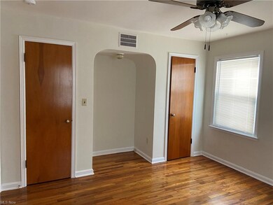 The first floor master bedroom has split closets a