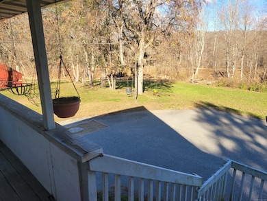 Porch and Yard Area With Path to Trails