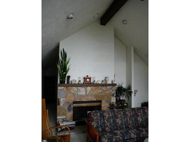 Living Room. The stone fireplace and vaulted ceili