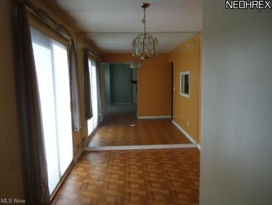 dining room with parquet flooring