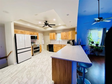 The kitchen is open to the living room