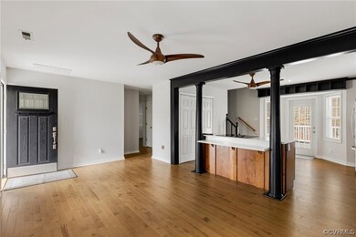 Kitchen with decorative columns, dark hardwood / w
