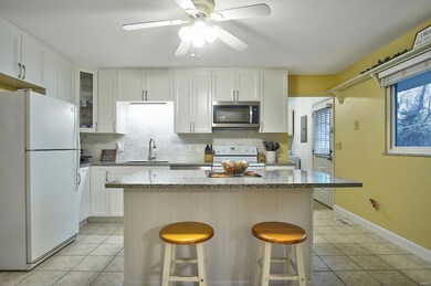 Beautiful white, soft close cabinetry, marble back