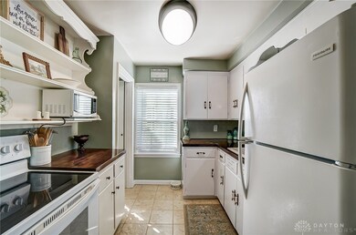 Adorable kitchen with open shelves and cabinets. A