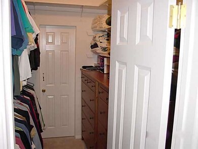 Walk in closet in master bedroom.