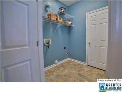 Laundry room that leads to the 2 car garage
