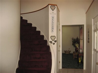 CURVED STAIRCASE TO UPPER FLOOR