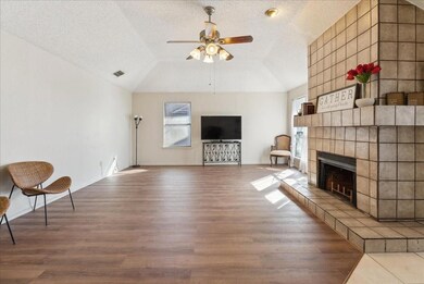 Unfurnished living room featuring lofted ceiling, 