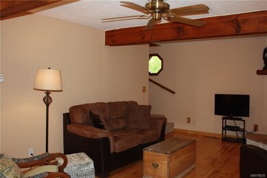 Living Room with large wood beamed ceiling