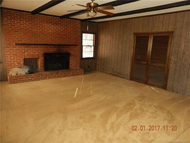Sunken den, with full masonry fireplace and gas lo