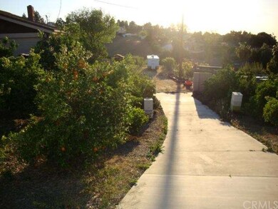 Paved driveway to rear of property.