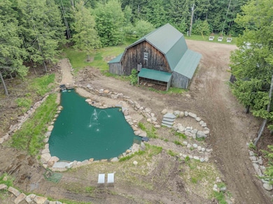 Large barn and spring-fed pond