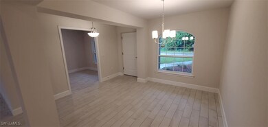 Spare room featuring light hardwood / wood-style f