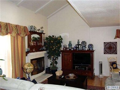 Cozy family room with vaulted ceilings and firepla