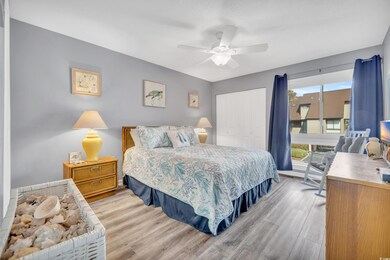 Bedroom featuring ceiling fan, a closet, and light