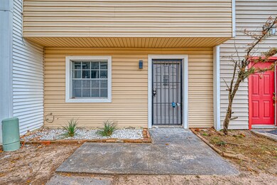 Townhouse front with freshly painted door and wind