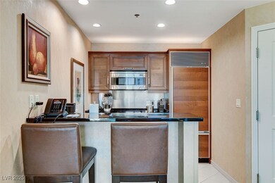 Kitchen with paneled refrigerator, stainless steel