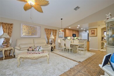 Tiled living room with vaulted ceiling and ceiling