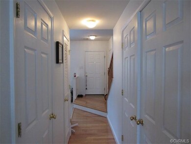 Wood floors in hall, laundry facilities and powder