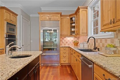 The kitchen has a double sink, a prep sink, plenty