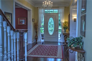 Entrance hallway showing the beautiful wood floor and formal dining to the left