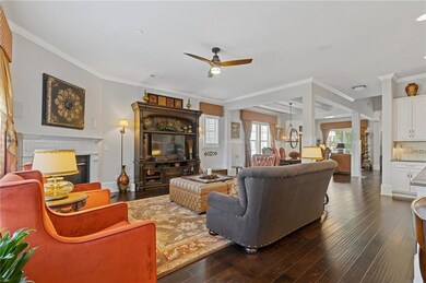 The great room offers a corner fireplace and lots 