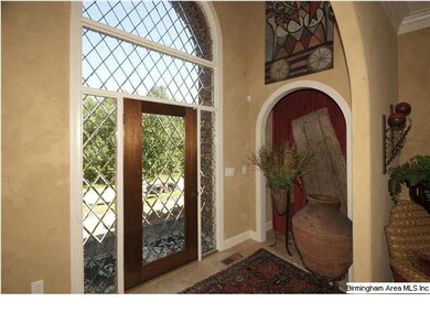 Inviting entryway with plenty of light and arched 