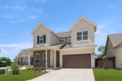 View of front of home with an attached garage, co