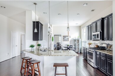 Survey the wondrous kitchen area highlighted by pendant and recessed lighting, gorgeous granite counter tops and stainless steel appliances. The breakfast bar is the perfect place for a quick snack or chatting with the cook!