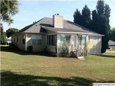Back of house showing sunroom addition.