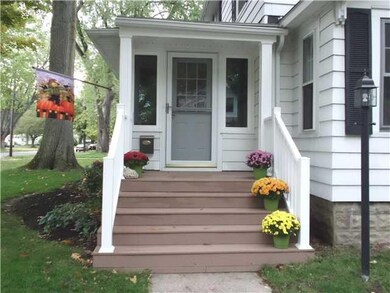Exterior Front. WELCOME-New Front Foyer/Porch, Trex decking, Vinyl columns & railings.