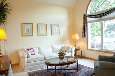 The living room is located just off of the entry, 