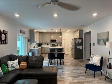 Kitchen view-tile flooring- glass backsplash-solid surface counters-sliders to rear yard
