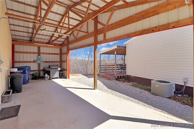 Car port attached to garage