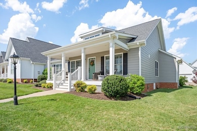 Bungalow with a porch, a front lawn, and roof with