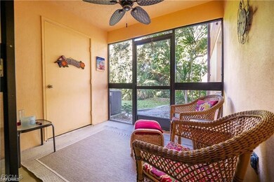 Sunroom / solarium featuring a textured wall