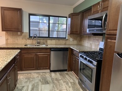 Stainless steel appliances and granite counter top