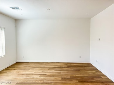 Empty room featuring light wood finished floors