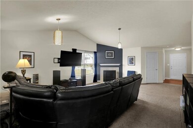 Oversized family room with vaulted ceilings and updated fixtures