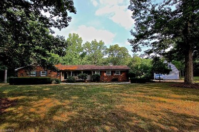 Sprawling ranch home on with almost 3 acres , a small lake , fruit trees and more!