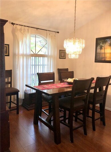 Dining room with vaulted ceiling to the right of t