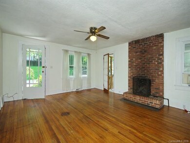 Living room with gas logs in the fireplace