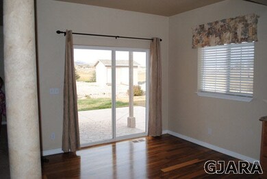 Informal dining area with sliding doors to the bac