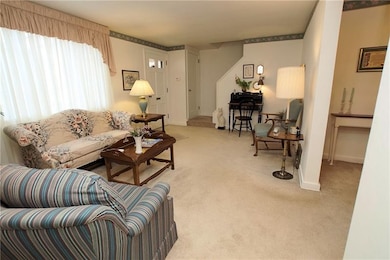 Large window in the living room, lets the sun shin